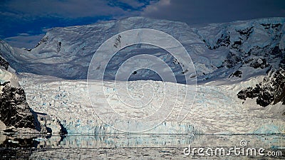 Glacier reaching into the ocean in Antarctica. Stock Photo