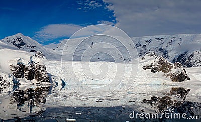 Glacier reaching into the ocean in Antarctica. Stock Photo