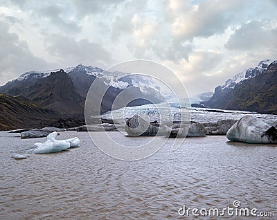 Glacier tongue slides from the Vatnajokull icecap or Vatna Glacier near subglacial Oraefajokull volcano, Iceland. Glacial lagoon Stock Photo