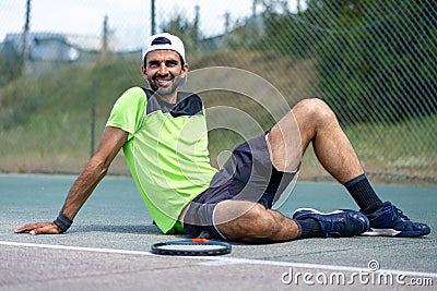Glad cheerful positive tennis player Stock Photo