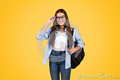 Glad pretty smart young student woman with backpack in glasses, enjoy lesson project Stock Photo