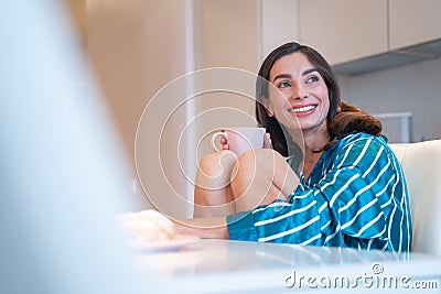 Mirthful relaxed woman with mug stock photo Stock Photo