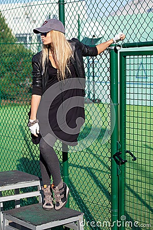 Glamorous blonde girl on the playground Stock Photo