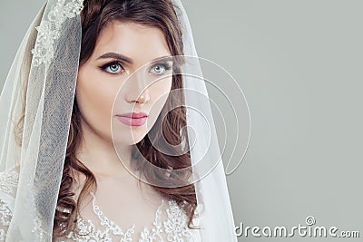 Glamorous bride woman with makeup and veil Stock Photo
