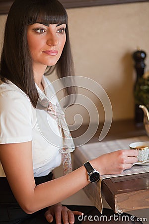 Glamorous brunette in a cafe Stock Photo