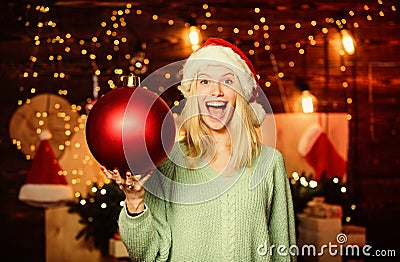 Glamorous decorations. Christmas decorations. Love to decorate everything around. Girl santa claus hold ball to decorate Stock Photo