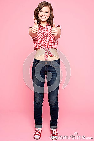 Glamorous girl gesturing double thumbs up Stock Photo