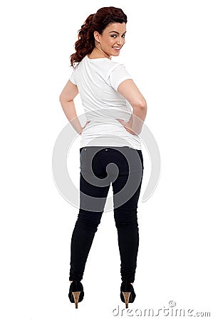 Glamorous girl turning back and looking at you Stock Photo