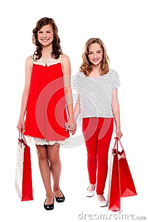 Glamorous girls walking after purchases Stock Photo