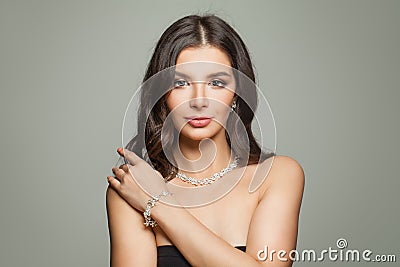 Glamorous jewelry model. Perfect brunette woman Stock Photo