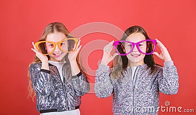 Glamorous little clubbers. Small kids in party glasses having fun. Cool party girls wearing fancy glasses. Party girls Stock Photo