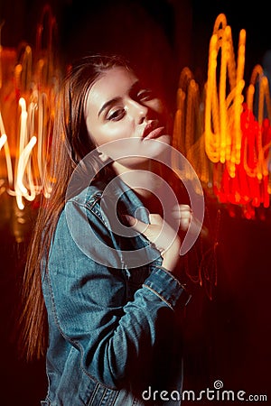 Glamorous model posing in mixed light technique at the street in Stock Photo