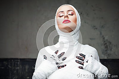 Glamorous mummy. Portrait of a young beautiful woman in bandages all over her body Stock Photo