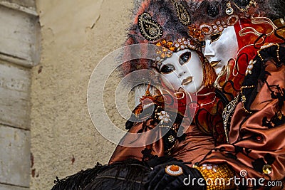 Glamorous and romantic couple with beautiful eyes and venetian mask during venice carnival Editorial Stock Photo