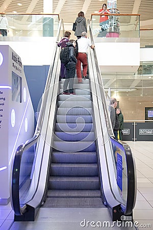 Internal view of customers on escalators inside a modern shopping centre mall Editorial Stock Photo