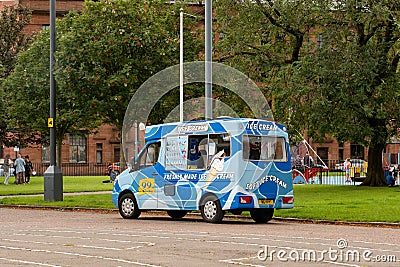 The blue Mercedes-Benz Sprinter van of the Mr Whippy Scotland company selling delicious ice cream at the Glasgow Green Park Editorial Stock Photo