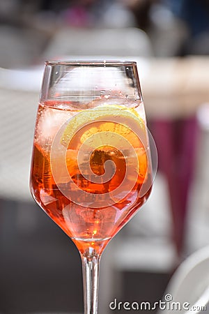 A glass of aperol sprits in outdoor cafe Stock Photo