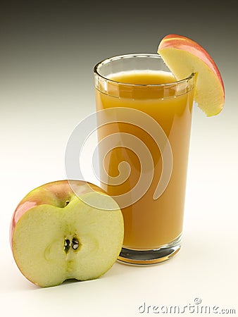 Glass of Apple Cider with Apple Pieces Stock Photo