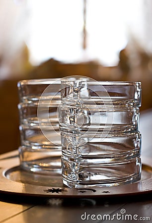 Glass ashtrays on bar Stock Photo