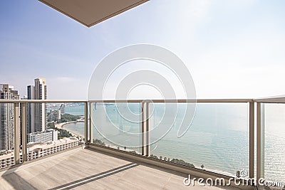 The glass balcony overlooks the sea. Stock Photo