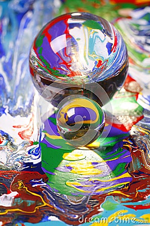 Glass balls on painting Stock Photo