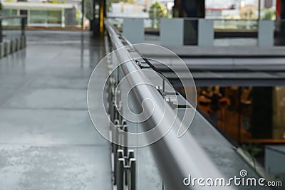 Glass barrier with metal handrail in modern building, closeup Stock Photo