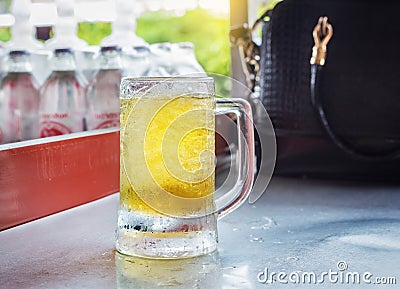 glass of beer in bar counter. Stock Photo