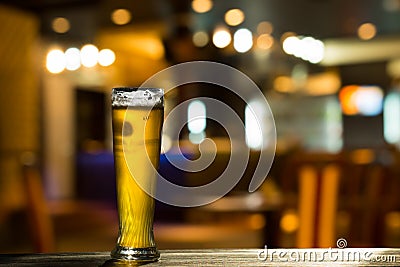 Glass of Beer on Bar Counter Stock Photo