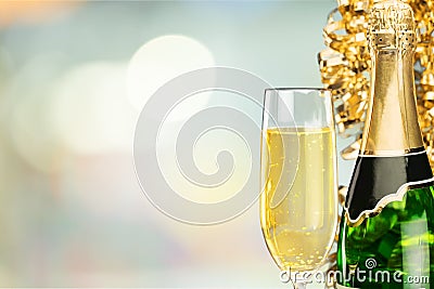 Glass and bottle of delicious champagne Stock Photo