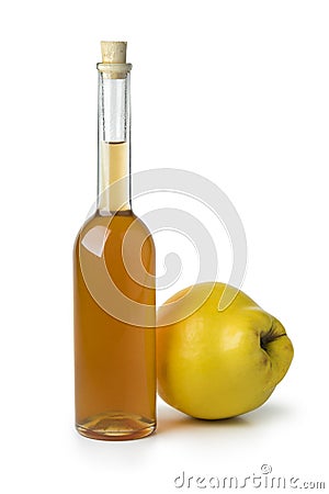 Glass bottle of homemade quince liqueur Stock Photo