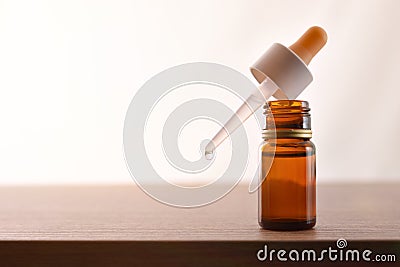 Glass bottle with pipette filled with medication for eyes Stock Photo