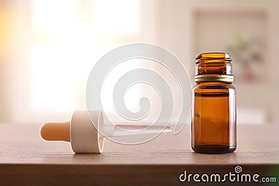 Glass bottle and pipette filled with medication for eyes room Stock Photo