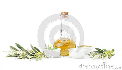 Glass bottle of premium virgin olive oil and herbs. Stock Photo