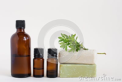 glass bottles of brown color and two bars of natural soap on a white isolated background. natural self-care. Mockup beauty Stock Photo