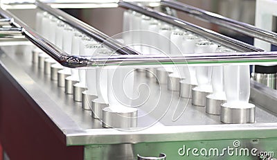 Glass bottles in cleaning process spraying by high pressure water Stock Photo