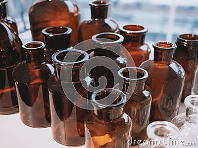 Glass bottles on shelf Vintage style Pharmacy Medical container Stock Photo