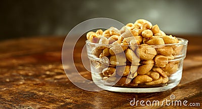 Glass bowl of fresh roasted salted peanuts Stock Photo