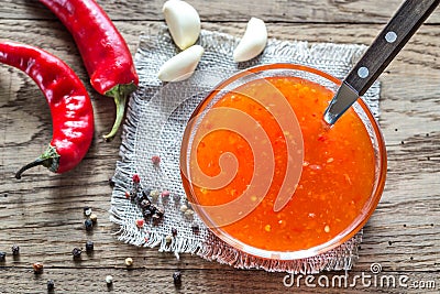 Glass bowl of thai sweet chili sauce Stock Photo