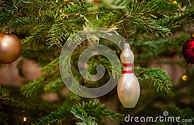 Glass bowling pins as decoration on a Christmas tree Stock Photo