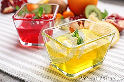 Glass bowls of tasty jelly desserts Stock Photo