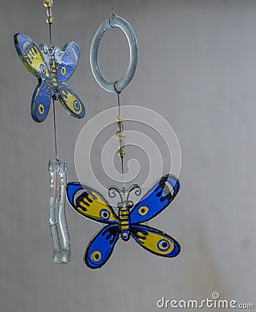 Glass butterflies dangle in a breeze Stock Photo