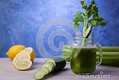 Cup with celery and cucumber juice, detox diet concept Stock Photo