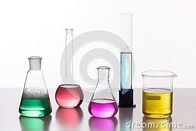 Glass in a chemical laboratory filled with colored liquid during Stock Photo