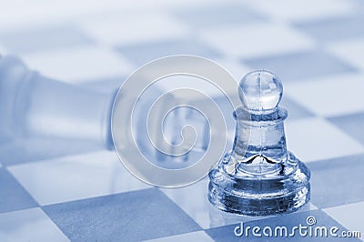 Glass chess. A victory of a pawn over a king Stock Photo