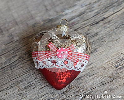 Glass Christmas toy on a wooden background. A heart. quadratic Stock Photo