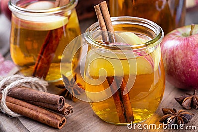 Glass of Cider With Apple Slices and Cinnamon Stock Photo