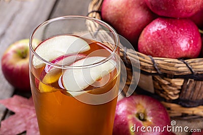 Glass of Cider With Apple Slices Stock Photo