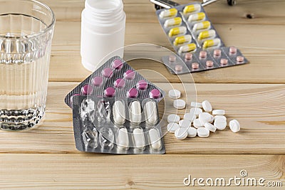 Glass of clean water and pill blister packs Stock Photo