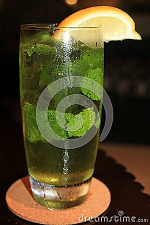 Glass of cold water, with mint fresh leaves and slice of orange Stock Photo