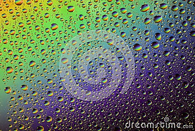 Water drops on the glass, rainbow effect Stock Photo